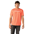 Person wearing a bright orange t-shirt with 'Bauer' logo on a white background