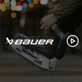lacing up brown and tan ice skates on a bench next to an outdoor rink
